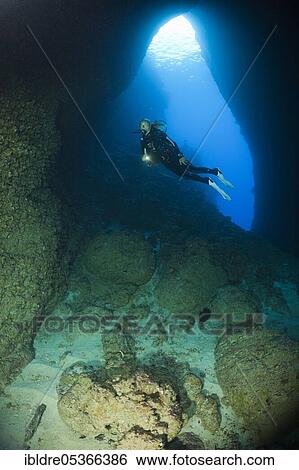 Stock Photograph - Diver in Bat Caves, Russell Islands, Solomon Islands, Oceania. Fotosearch