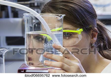 Doctoral student during her research work on a film drawing bench at the Institute for Pharmaceutical Technology and Biopharmacy at Heinrich-Heine-University Düsseldorf, North Rhine-Westphalia, Germany, Europe View Large Photo Image Stock Image - Doctoral student during her research work on a film drawing bench at the Institute for Pharmaceutical Technology and Biopharmacy at Heinrich-Heine-University Düsseldorf, North Rhine-Westphalia, Germany, Europe. Fotosearch
