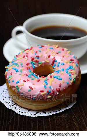 Donut and cup of coffee, icing, sugar glaze View Large Photo Image Stock Photo - Donut and cup of coffee, icing, sugar glaze. Fotosearch