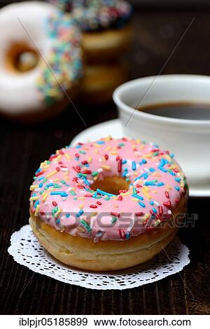 Donut and cup of coffee, icing, sugar glaze View Large Photo Image Stock Photo - Donut and cup of coffee, icing, sugar glaze. Fotosearch