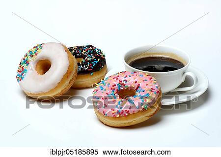 Donuts and cup of coffee, icing, sugar glaze View Large Photo Image Stock Photography - Donuts and cup of coffee, icing, sugar glaze. Fotosearch