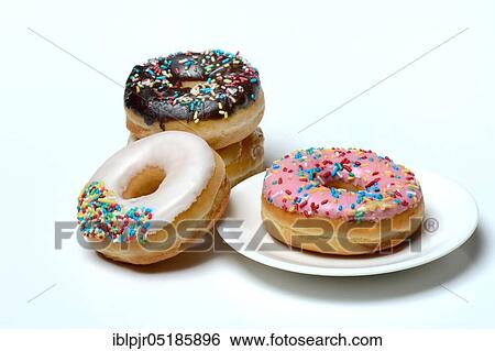 Donuts, sugar icing, sugar glaze View Large Photo Image Stock Photograph - Donuts, sugar icing, sugar glaze. Fotosearch