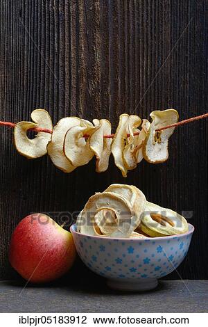 Dried apple slices, dried apple rings strung on string and apples, variety Gala View Large Photo Image Stock Image - Dried apple slices, dried apple rings strung on string and apples, variety Gala. Fotosearch