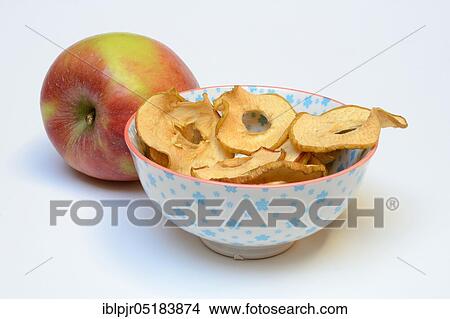 Picture - Dried apple slices in peel, apple ring, apple rings, apple slice. Fotosearch