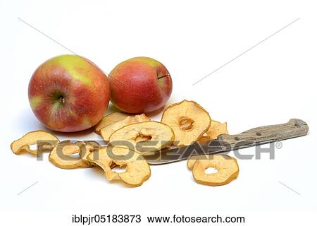 Stock Image - Dried apple slices with knife, apple ring, apple rings, apple slice. Fotosearch