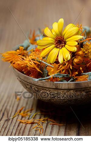 Stock Photo - Dried marigold blossoms in bowl. Fotosearch