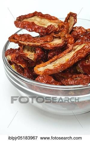 Dried tomatoes in glass bowl, antipasti View Large Photo Image Stock Photo - Dried tomatoes in glass bowl, antipasti. Fotosearch