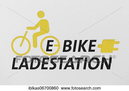 Stock Image - E-bike charging station, pictogram and lettering, Düsseldorf, North Rhine-Westphalia, Germany, Europe. Fotosearch