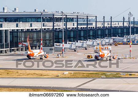 EasyJet planes at Berlin Brandenburg BER Airport Terminal aerial view in Berlin, Germany, Europe View Large Photo Image Stock Image - EasyJet planes at Berlin Brandenburg BER Airport Terminal aerial view in Berlin, Germany, Europe. Fotosearch