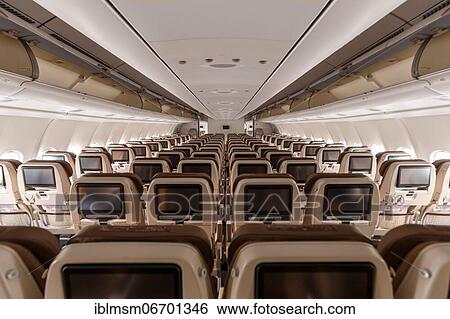 Economy class cabin of an Airbus A340-300 aircraft of Swiss at Zurich airport, Switzerland, Europe View Large Photo Image Stock Photograph - Economy class cabin of an Airbus A340-300 aircraft of Swiss at Zurich airport, Switzerland, Europe. Fotosearch