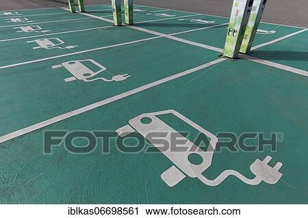 Electric car parking and charging stations, pictograms on the ground, Neuss, North Rhine-Westphalia, Germany, Europe View Large Photo Image Stock Image - Electric car parking and charging stations, pictograms on the ground, Neuss, North Rhine-Westphalia, Germany, Europe. Fotosearch