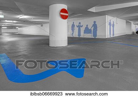 Empty underground car park and blue arrow on the floor, Biberach, Baden-Württemberg, Germany, Europe View Large Photo Image Stock Image - Empty underground car park and blue arrow on the floor, Biberach, Baden-Württemberg, Germany, Europe. Fotosearch