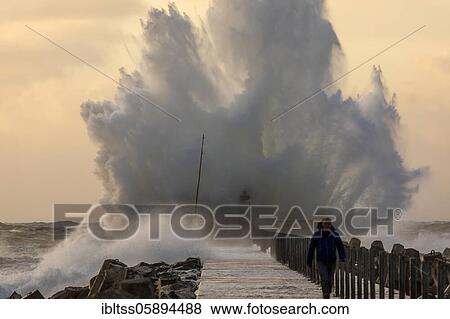 Stock Photo - Evening atmosphere at the stormy harbour Vorupör, North Jutland, Denmark, Europe. Fotosearch