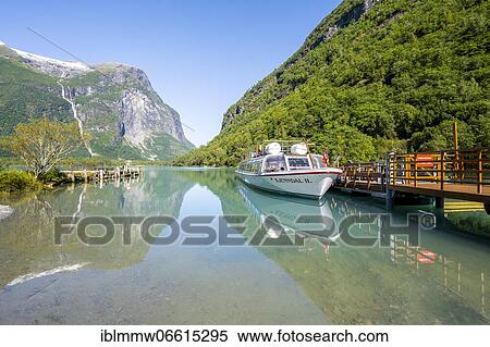 Excursion boat at lake Lovatnet, Kjenndalstova, Loen, Vestland, Norway, Europe View Large Photo Image Stock Photography - Excursion boat at lake Lovatnet, Kjenndalstova, Loen, Vestland, Norway, Europe. Fotosearch