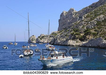 Excursion boats on the Mediterranean Sea, Calanques National Park, Marseille, Provence, Cote d'Azur, France, Europe View Large Photo Image Stock Photo - Excursion boats on the Mediterranean Sea, Calanques National Park, Marseille, Provence, Cote d'Azur, France, Europe. Fotosearch
