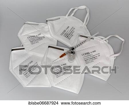 FFP2 masks, Corona masks for mouth and nose, Vaccine vial, Biontech, Pfizer, against Covid 19, Syringe View Large Photo Image Picture - FFP2 masks, Corona masks for mouth and nose, Vaccine vial, Biontech, Pfizer, against Covid 19, Syringe. Fotosearch