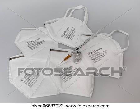 FFP2 masks, Corona masks for mouth and nose, Vaccine vial, Biontech, Pfizer, against Covid 19, Syringe View Large Photo Image Stock Image - FFP2 masks, Corona masks for mouth and nose, Vaccine vial, Biontech, Pfizer, against Covid 19, Syringe. Fotosearch