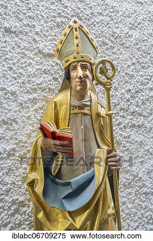 Figure of a saint with crosier and book, church St, Johann Baptist, Ismaning, Upper Bavaria, Bavaria, Germany, Europe View Large Photo Image Stock Photography - Figure of a saint with crosier and book, church St, Johann Baptist, Ismaning, Upper Bavaria, Bavaria, Germany, Europe. Fotosearch