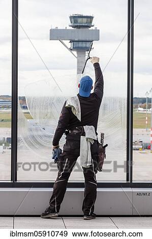 Stock Photo - Final cleaning work at the new Berlin Brandenburg BER Willy Brandt Airport Terminal 1, Berlin, Germany, Europe. Fotosearch