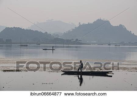 Fisherman in his canoe fishing, Loktak Lake, Moirang, Manipur, India, Asia View Large Photo Image Stock Photo - Fisherman in his canoe fishing, Loktak Lake, Moirang, Manipur, India, Asia. Fotosearch