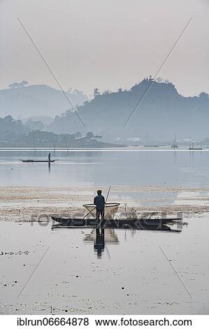 Fisherman in his canoe fishing, Loktak Lake, Moirang, Manipur, India, Asia View Large Photo Image Stock Photo - Fisherman in his canoe fishing, Loktak Lake, Moirang, Manipur, India, Asia. Fotosearch