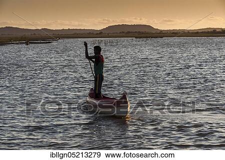 Stock Photo - Fisherman with pirogue at the Manambolo, Bekopaka, Madagascar, Africa. Fotosearch