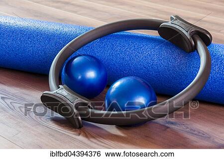 Stock Photograph - Foam roll, balls and ring, utensils for Pilates training. Fotosearch