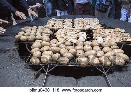 Stock Photo - Food, potatoes and chicken being cooked on volcanic grill, visitor centre, Parque Nacional de Timanfaya, national park, Lanzarote, Canary Islands. Fotosearch