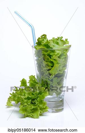 Friseesalad in glass with straw, salad leaves, smoothie View Large Photo Image Picture - Friseesalad in glass with straw, salad leaves, smoothie. Fotosearch