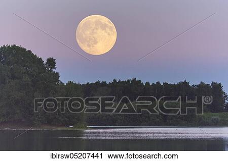 Stock Image - Full moon over the Dammer mountain lake, Dammer Berge, Lower Saxony, Germany, Europe. Fotosearch