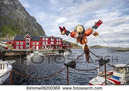 Stock Photo - Funny figure, Traditional red stilt houses, typical fishermen huts, Å i Lofoten, Lofoten, Nordland, Norway, Europe. Fotosearch