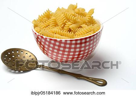 Fusilli, spiral noodles in bowl View Large Photo Image Stock Photograph - Fusilli, spiral noodles in bowl. Fotosearch