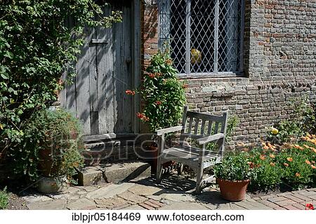 Garden chair in front of country house, Sissinghurst Castle, Sissinghurst Castle, Kent, England, Great Britain View Large Photo Image Stock Photo - Garden chair in front of country house, Sissinghurst Castle, Sissinghurst Castle, Kent, England, Great Britain. Fotosearch