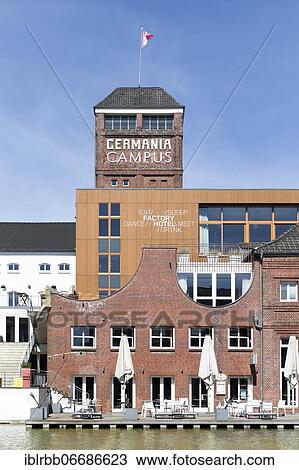Stock Image - Germania brewery from 1898, today city quarter Germania-Campus with residential and commercial buildings, hotel, gastronomy, leisure and health facilities, Münster, Westphalia, North Rhine-Westphalia, Germany, Europe. Fotosearch
