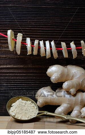Stock Photo - Ginger Tuber (Zingiber officinale) powder and discs hung up to dry. Fotosearch