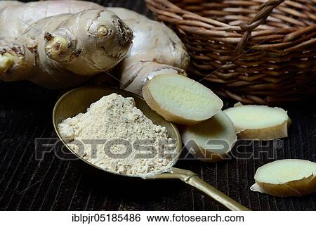 Stock Photograph - Ginger (Zingiber officinale) and powder in ladle. Fotosearch