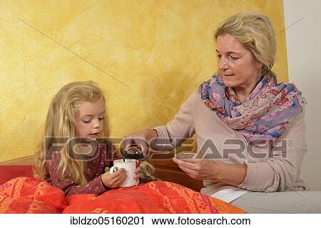 Girl drinking elderberry juice (Sambucus nigra) (Sambuci fructus) View Large Photo Image Stock Image - Girl drinking elderberry juice (Sambucus nigra) (Sambuci fructus). Fotosearch