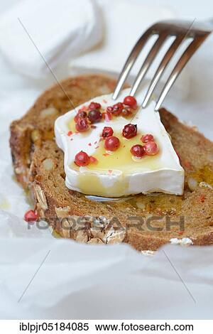 Goat cheese, on slice of bread, with berries, with olive oil, pepper View Large Photo Image Stock Photography - Goat cheese, on slice of bread, with berries, with olive oil, pepper. Fotosearch
