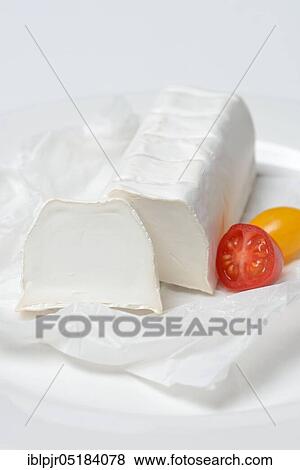 Goat cheese with cherry tomatoes, goat cheese View Large Photo Image Stock Photo - Goat cheese with cherry tomatoes, goat cheese. Fotosearch
