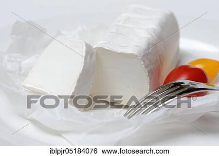 Goat cheese with fork and cherry tomatoes, goat cheese View Large Photo Image Stock Photograph - Goat cheese with fork and cherry tomatoes, goat cheese. Fotosearch