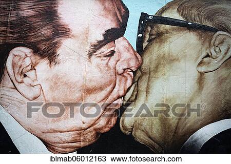 Graffiti brotherly kiss between Leonid Brezhnev and Erich Honecker, artist Dimitrij Vrubel, East Side Gallery, Berlin, Germany, Europe View Large Photo Image Stock Image - Graffiti brotherly kiss between Leonid Brezhnev and Erich Honecker, artist Dimitrij Vrubel, East Side Gallery, Berlin, Germany, Europe. Fotosearch