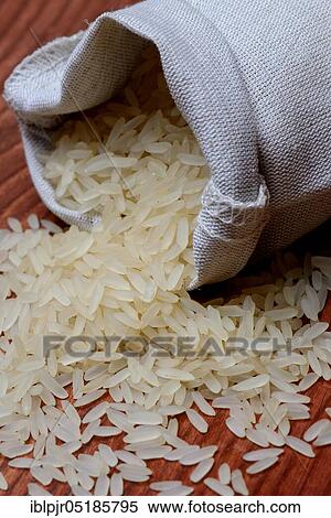 Stock Photography - Grains of rice ( Oryza sativa), uncooked. Fotosearch