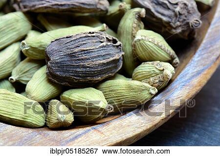 Green and ( Amomum subulatum) in wooden spoon View Large Photo Image Stock Photo - Green and ( Amomum subulatum) in wooden spoon. Fotosearch