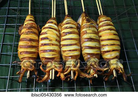 Grilled squid skewers, Naka Weekend Market, Phuket, Thailand, Asia View Large Photo Image Stock Photograph - Grilled squid skewers, Naka Weekend Market, Phuket, Thailand, Asia. Fotosearch