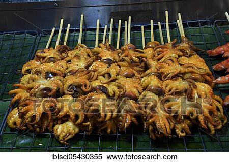 Grilled squid skewers, Naka Weekend Market, Phuket, Thailand, Asia View Large Photo Image Stock Photography - Grilled squid skewers, Naka Weekend Market, Phuket, Thailand, Asia. Fotosearch