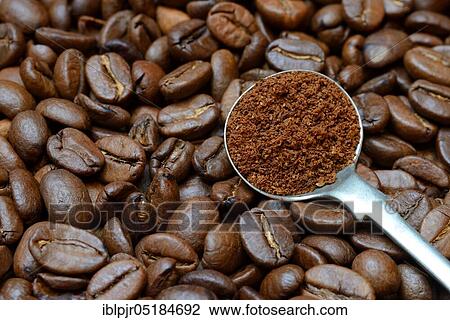 Stock Image - Ground coffee in ladle. Fotosearch
