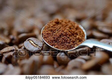 Stock Image - Ground coffee in ladle. Fotosearch