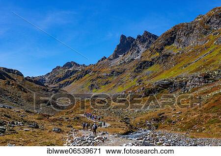 Group of hikers, hiking trail to Klostertaler Umwelthütte, Klostertal, Silvretta Group, Vorarlberg, Austria, Europe View Large Photo Image Stock Image - Group of hikers, hiking trail to Klostertaler Umwelthütte, Klostertal, Silvretta Group, Vorarlberg, Austria, Europe. Fotosearch