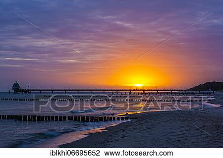Groyne and diving gondola with pier at the beach of Zingst at sunrise, Zingst, peninsula Zingst, Darß, Fischland, Baltic Sea, Mecklenburg-Western Pomerania, East Germany View Large Photo Image Stock Image - Groyne and diving gondola with pier at the beach of Zingst at sunrise, Zingst, peninsula Zingst, Darß, Fischland, Baltic Sea, Mecklenburg-Western Pomerania, East Germany. Fotosearch