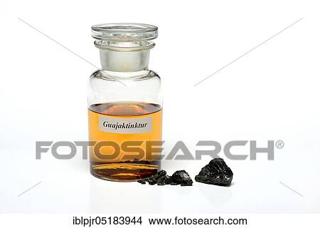 Guajactincture (Guaiacum officinale) in bottle and guaiac resin, resin, guaiac tree resin, tree resin, guaiac reaction View Large Photo Image Picture - Guajactincture (Guaiacum officinale) in bottle and guaiac resin, resin, guaiac tree resin, tree resin, guaiac reaction. Fotosearch